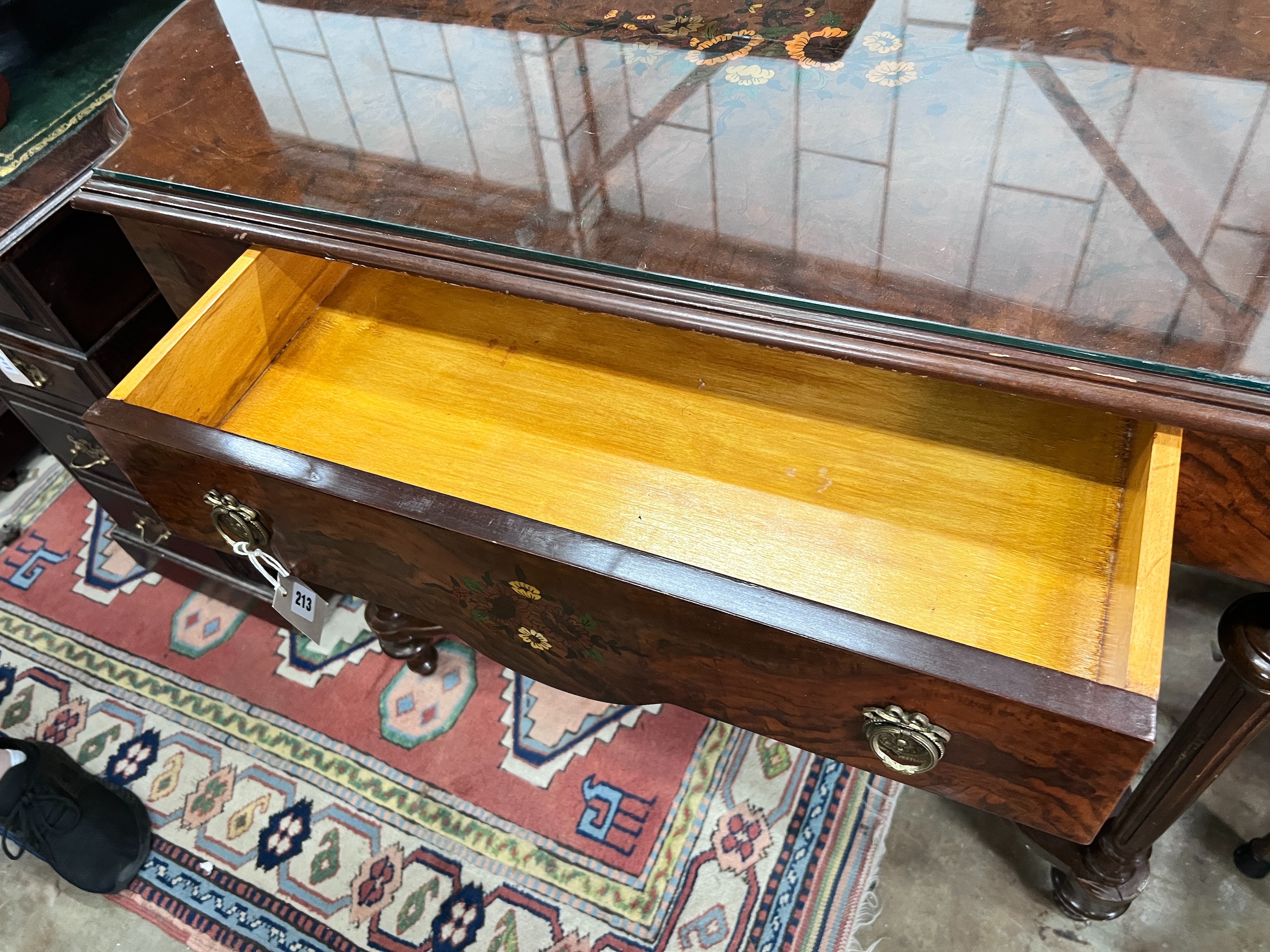 A continental marquetry inlaid walnut centre table, 117 x 59cm *Please note the sale commences at 9am.